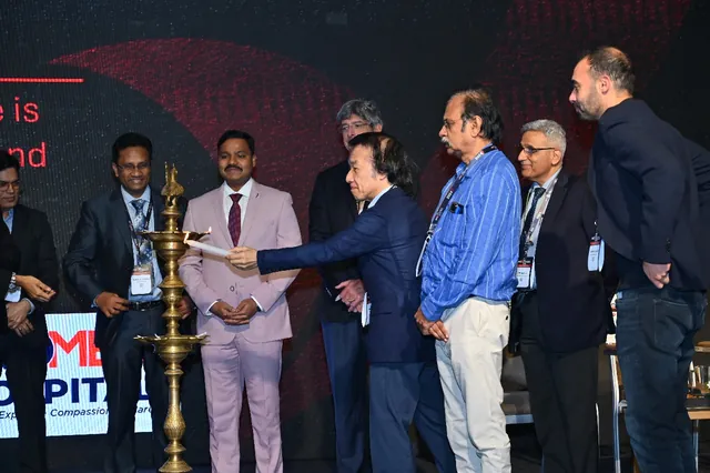 Faculty gathered around the lamp during the opening