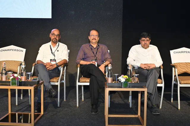 A chaired panel session in progress on the main stage