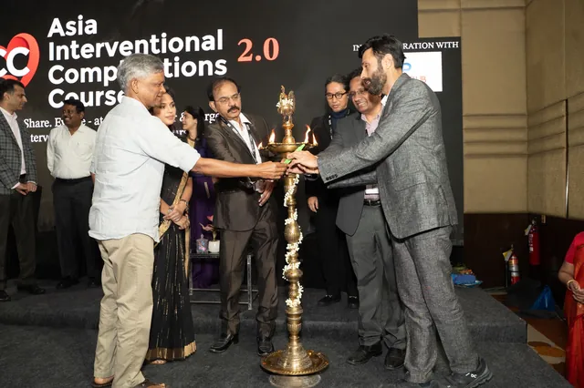 Faculty gathered around the lamp at the opening